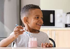 Kid enjoying a smoothie