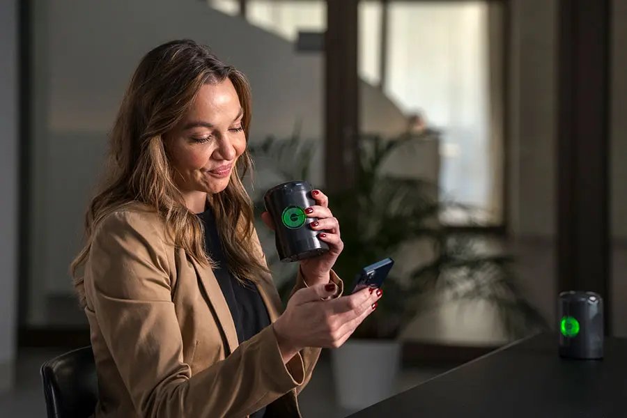Woman using the app for the Myromi device