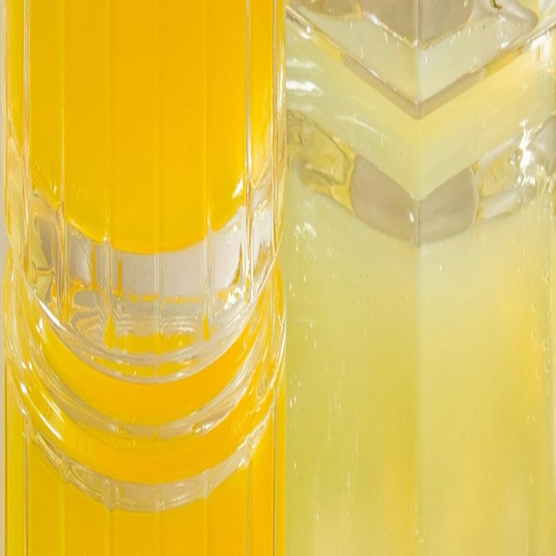 Close up of two glasses with citrus-like beverages