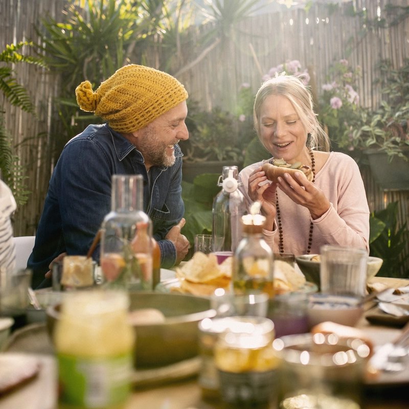 A group of people enjoying an outdoors lunch