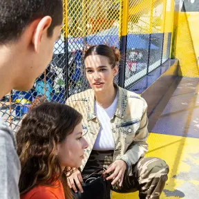Three teens hanging out together and chatting